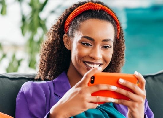 A social media influencer using ai networking tools on her phone.